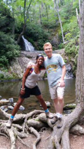 Mrs. Bonner-Reynolds and husband near waterfall