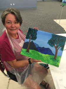 Mrs. Rowley with painting