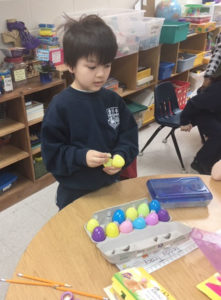 kindergarten boy with Easter eggs