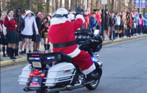Santa arriving on motorcycle