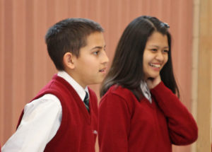 boy and girl in school uniforms