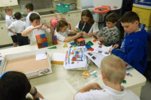students building with electronics